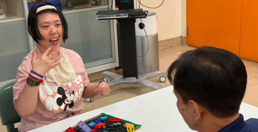 Yee Hua with Senior Occupational Therapist Dedi